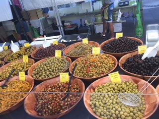 Olives of many local flavors at street market in Pezenas, France